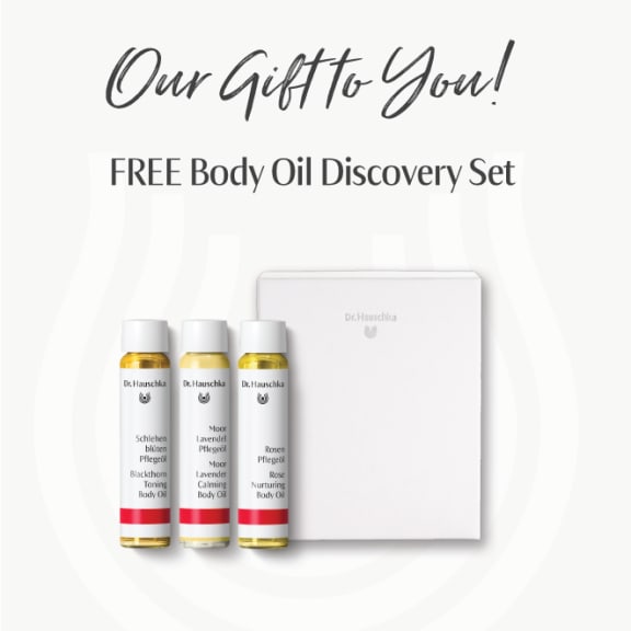 Promotional graphic reading 'Our Gift to You! Free Body Oil Discovery Set' with three body oil bottles and a white box.