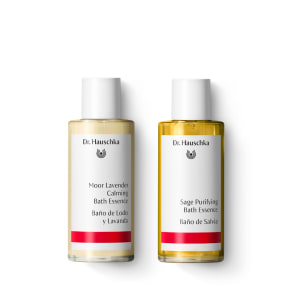 Two Dr. Hauschka bath essence bottles: Moor Lavender Calming and Sage Purifying, on a white background.