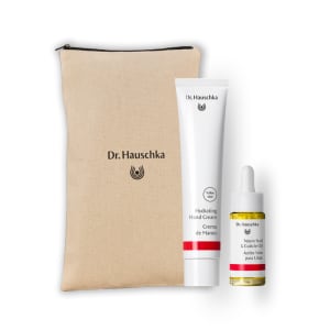 Dr. Hauschka hand and nail care gift set with beige pouch, hand cream tube and cuticle oil bottle.