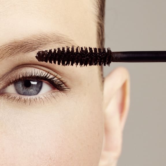 applying long lasting mascara