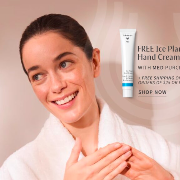 Smiling woman in a white robe with hand cream tube and promo text for free Ice Plant Hand Cream with Med purchase.