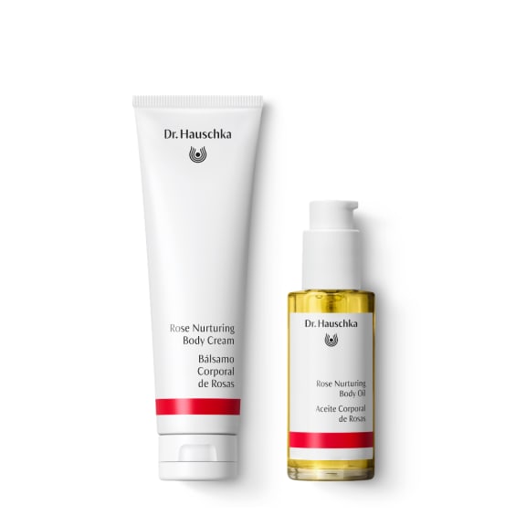 Dr. Hauschka Rose Nurturing Body Cream tube and Body Oil bottle on a white background.