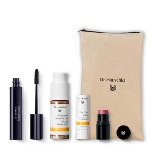 Dr. Hauschka gift set with mascara, bronzing tint, lip care stick, lipstick and beige zip pouch.