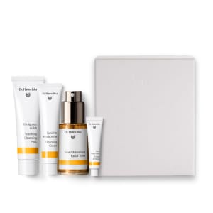 Dr. Hauschka skincare discovery set with four products and a white box on a plain background.