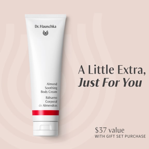 Dr. Hauschka Almond Soothing Body Cream tube on a pale pink background with text: A Little Extra, Just For You and $37 value.