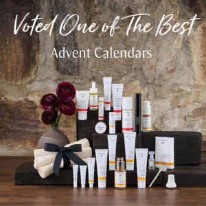 Dr. Hauschka advent calendar products arranged on steps with flowers, under text reading 'Voted One of The Best Advent Calendars'.