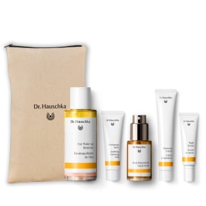 Dr. Hauschka overnight renewal gift set with beige pouch and five skincare products on white background.