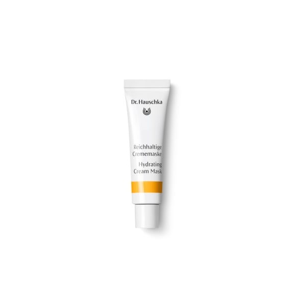 White Dr. Hauschka Hydrating Cream Mask tube with orange band on a plain white background.