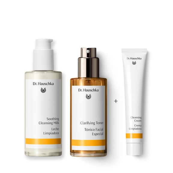 Dr. Hauschka skincare gift set: Soothing Cleansing Milk, Clarifying Toner, and Cleansing Cream on white background.