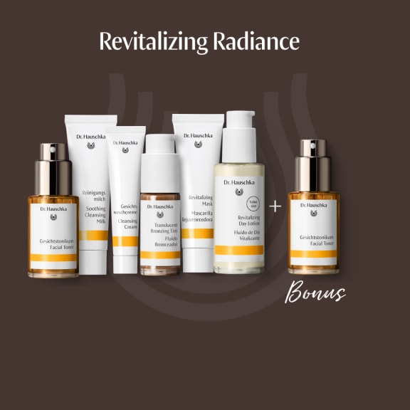 Dr. Hauschka skincare gift set on brown background, with toner, cleansers, mask, day lotion and a bonus toner.