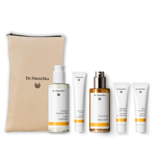 Dr. Hauschka hydrating gift set with five skincare products and a beige canvas pouch on a white background.